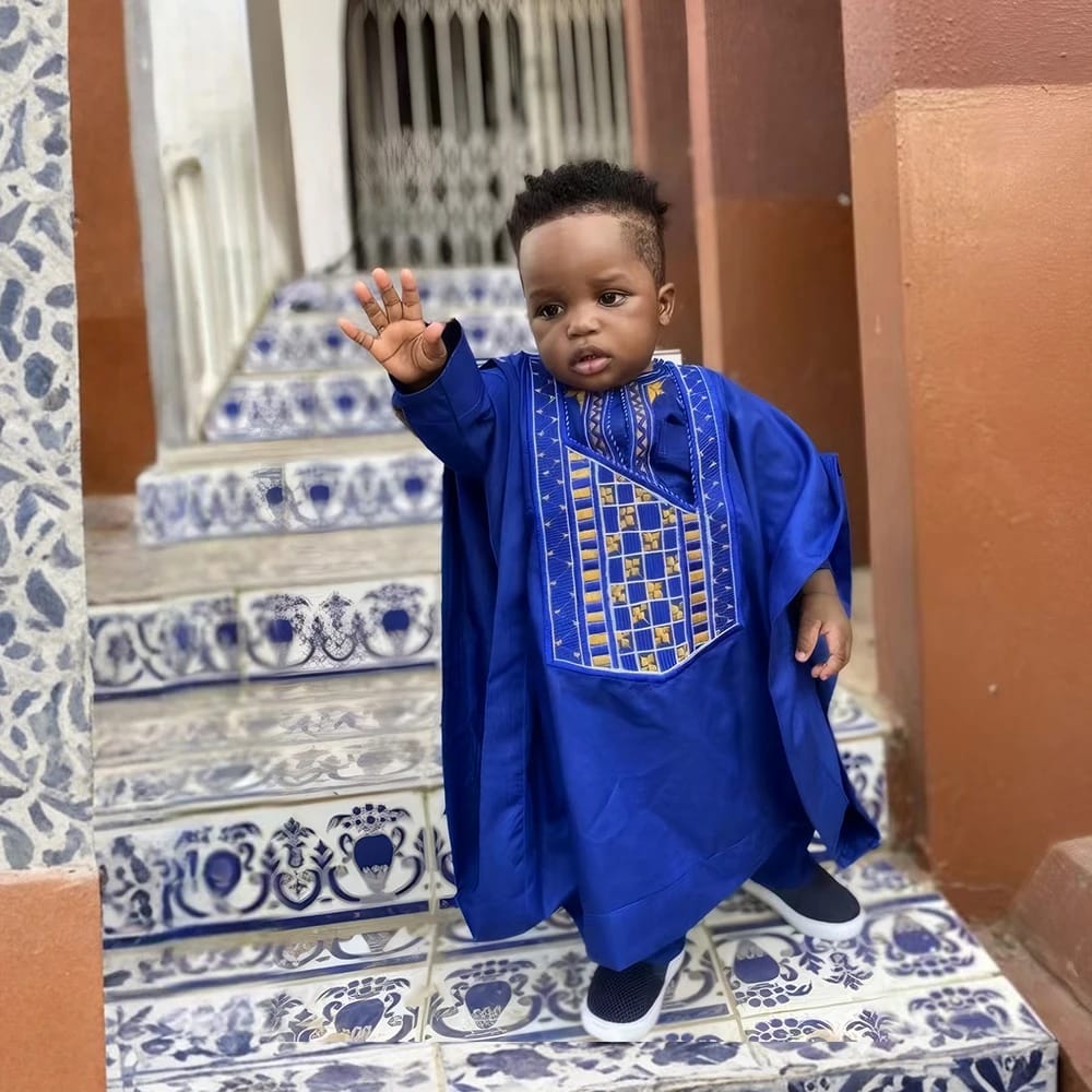 Young boy in royal blue embroidered mini Agbada with trousers