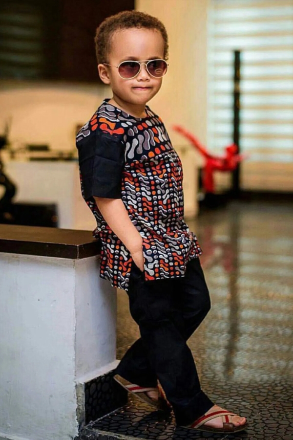 Boy in patterned Ankara tunic with black trousers