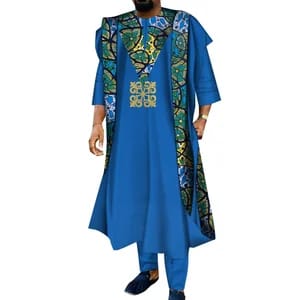 Man in blue Agbada set with Ankara panels and gold emblem