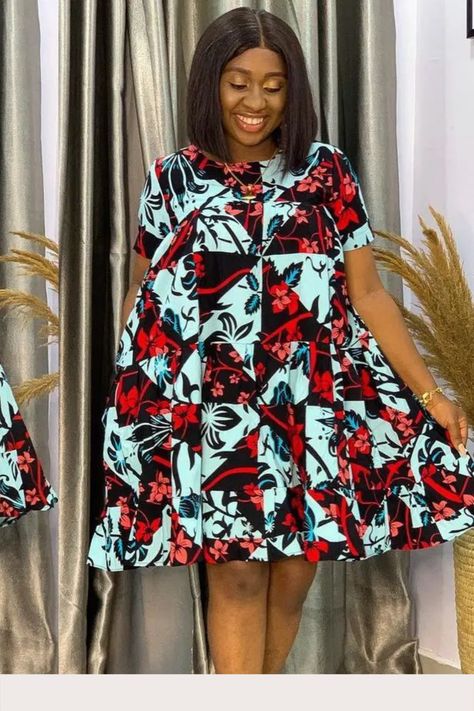 Model in turquoise and red Ankara tiered smock dress